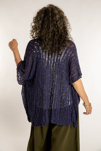 Susan is wear the Cascade Loose Weave Cardigan in Navy