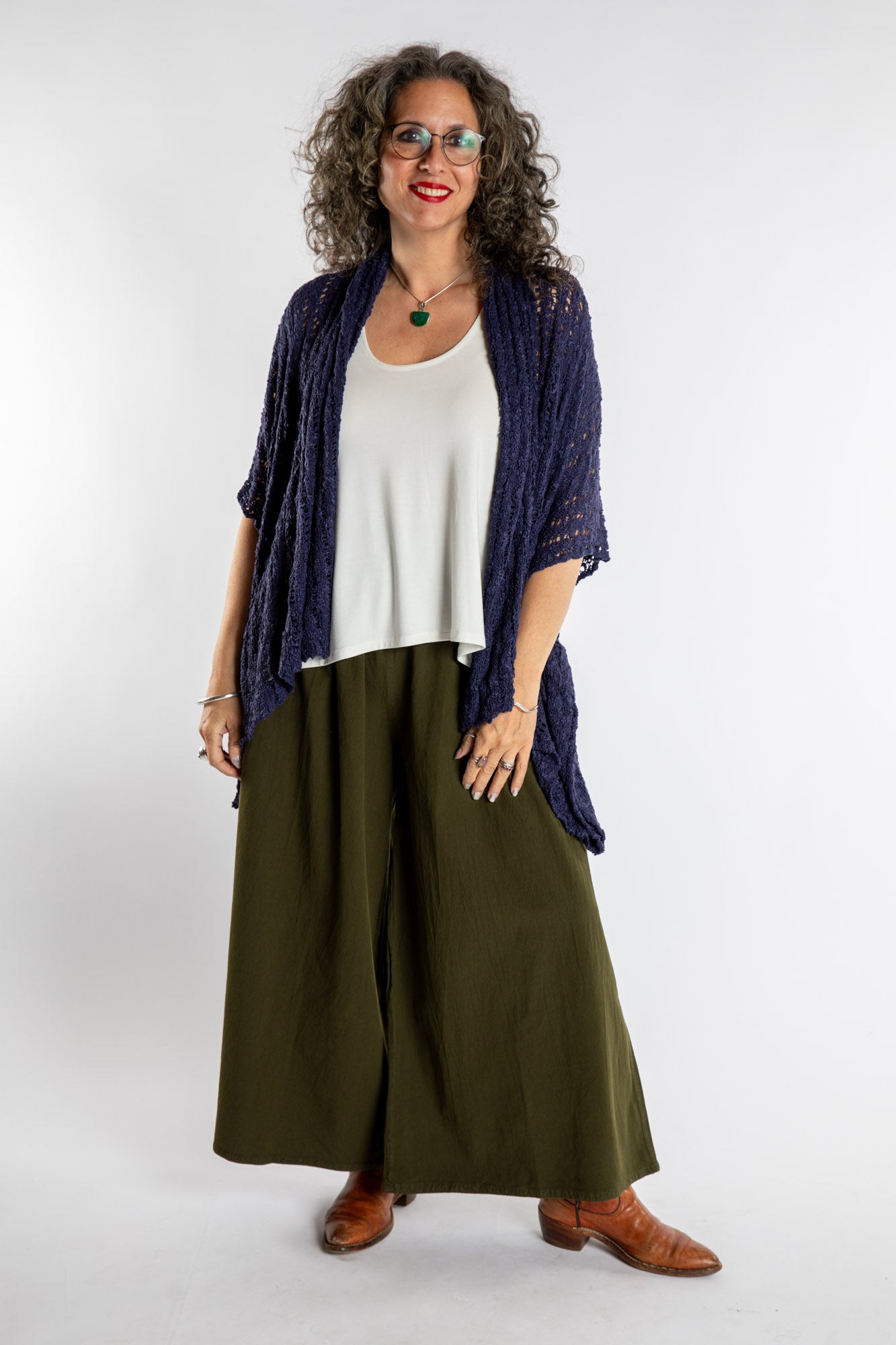 Susan is wear the Cascade Loose Weave Cardigan in Navy