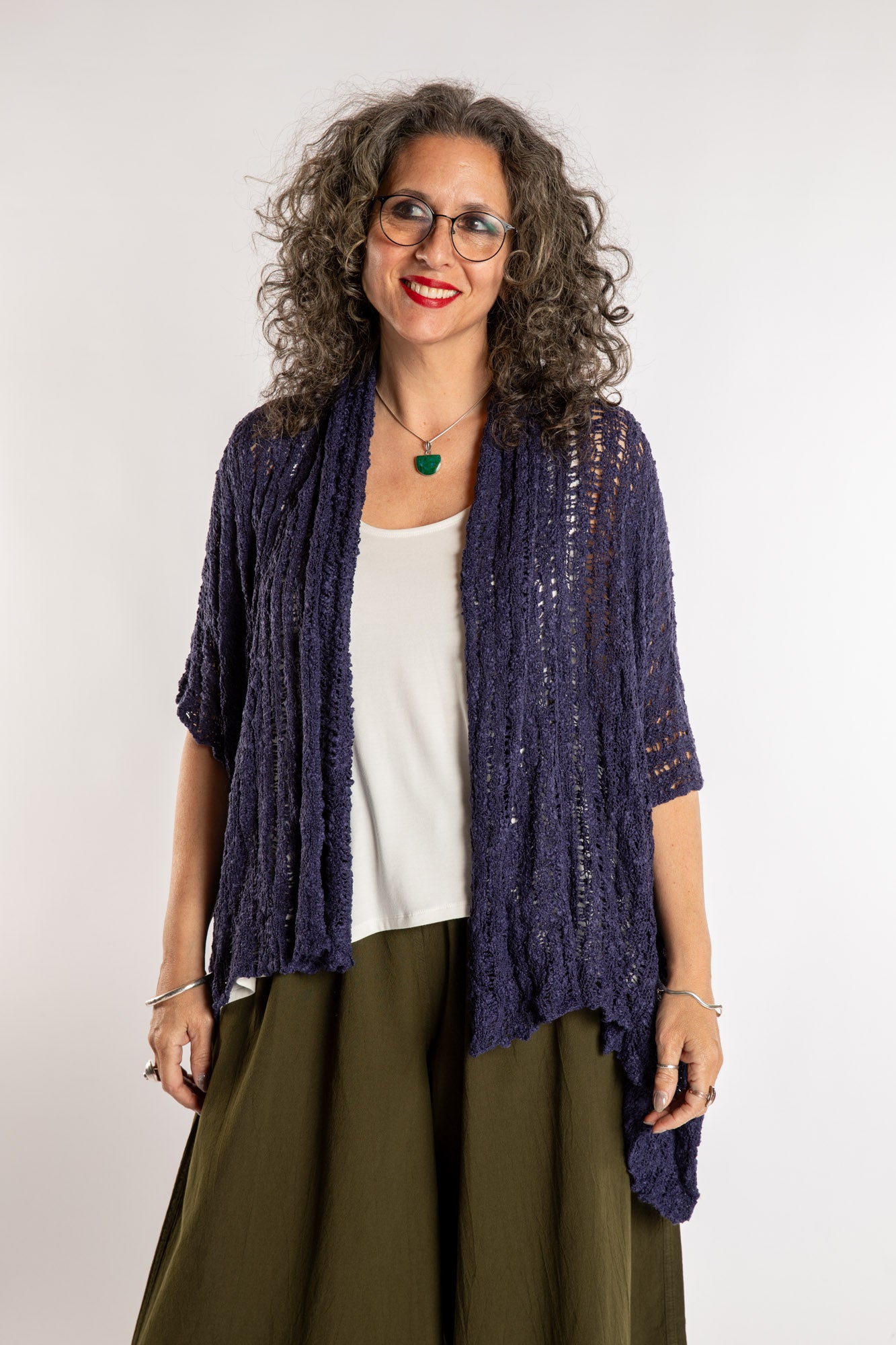 Susan is wear the Cascade Loose Weave Cardigan in Navy