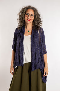 Susan is wear the Cascade Loose Weave Cardigan in Navy