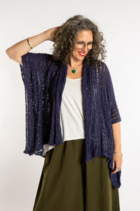 Susan is wear the Cascade Loose Weave Cardigan in Navy