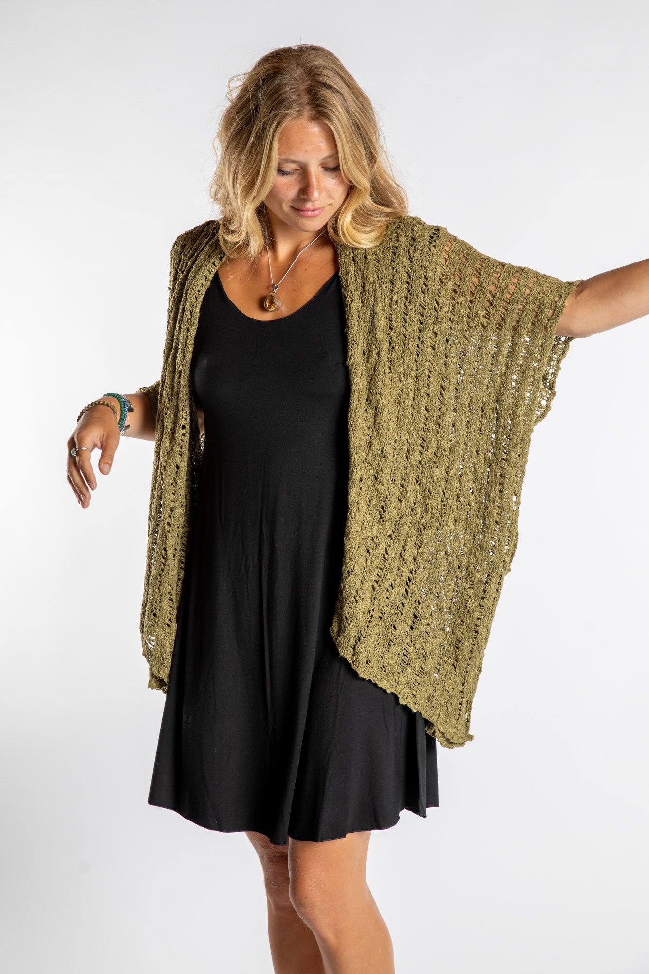 Sophie is wear the Cascade Loose Weave Cardigan in Olive