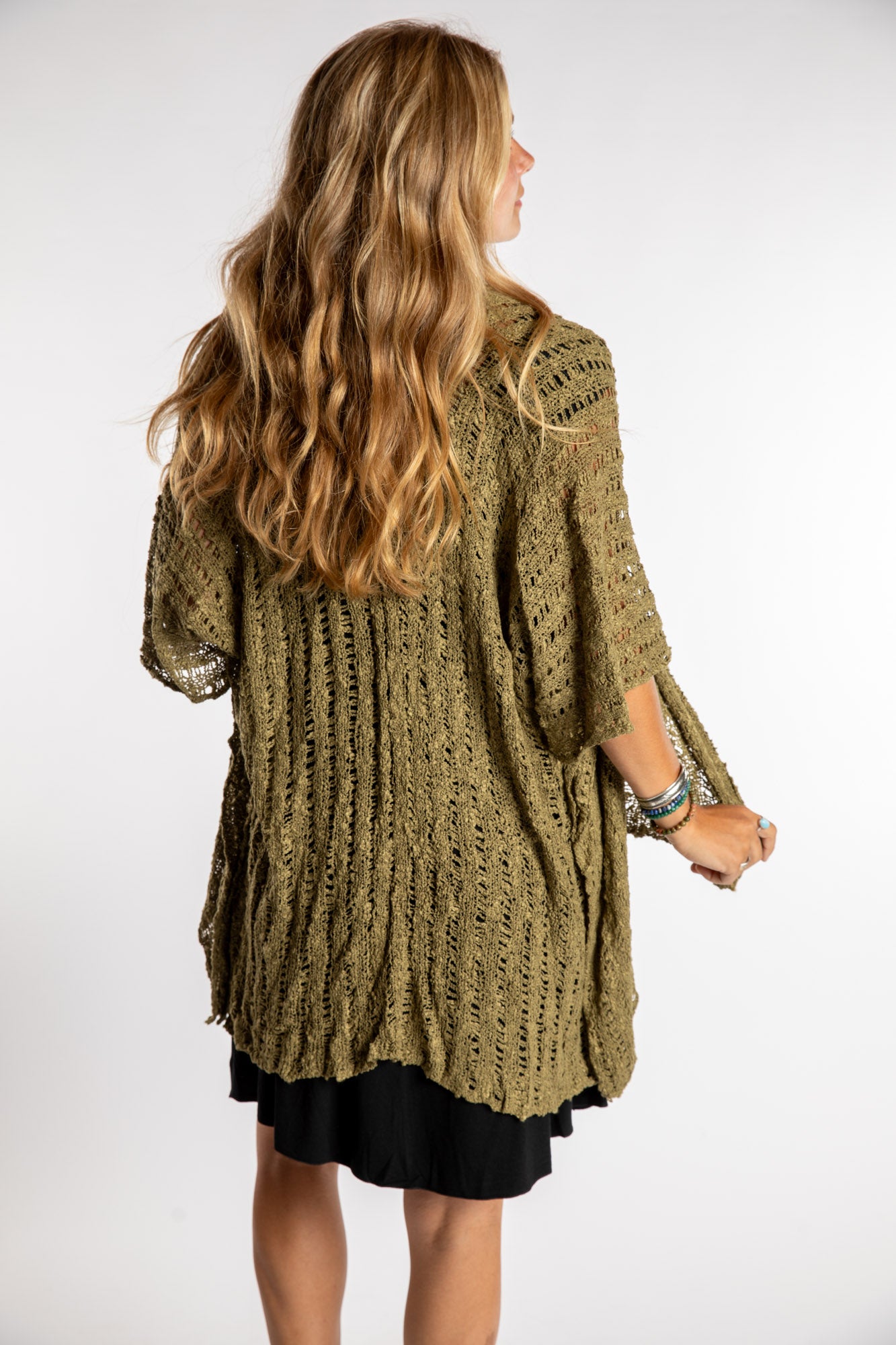 Sophie is wear the Cascade Loose Weave Cardigan in Olive