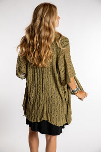 Sophie is wear the Cascade Loose Weave Cardigan in Olive