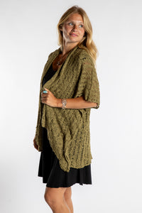 Sophie is wear the Cascade Loose Weave Cardigan in Olive