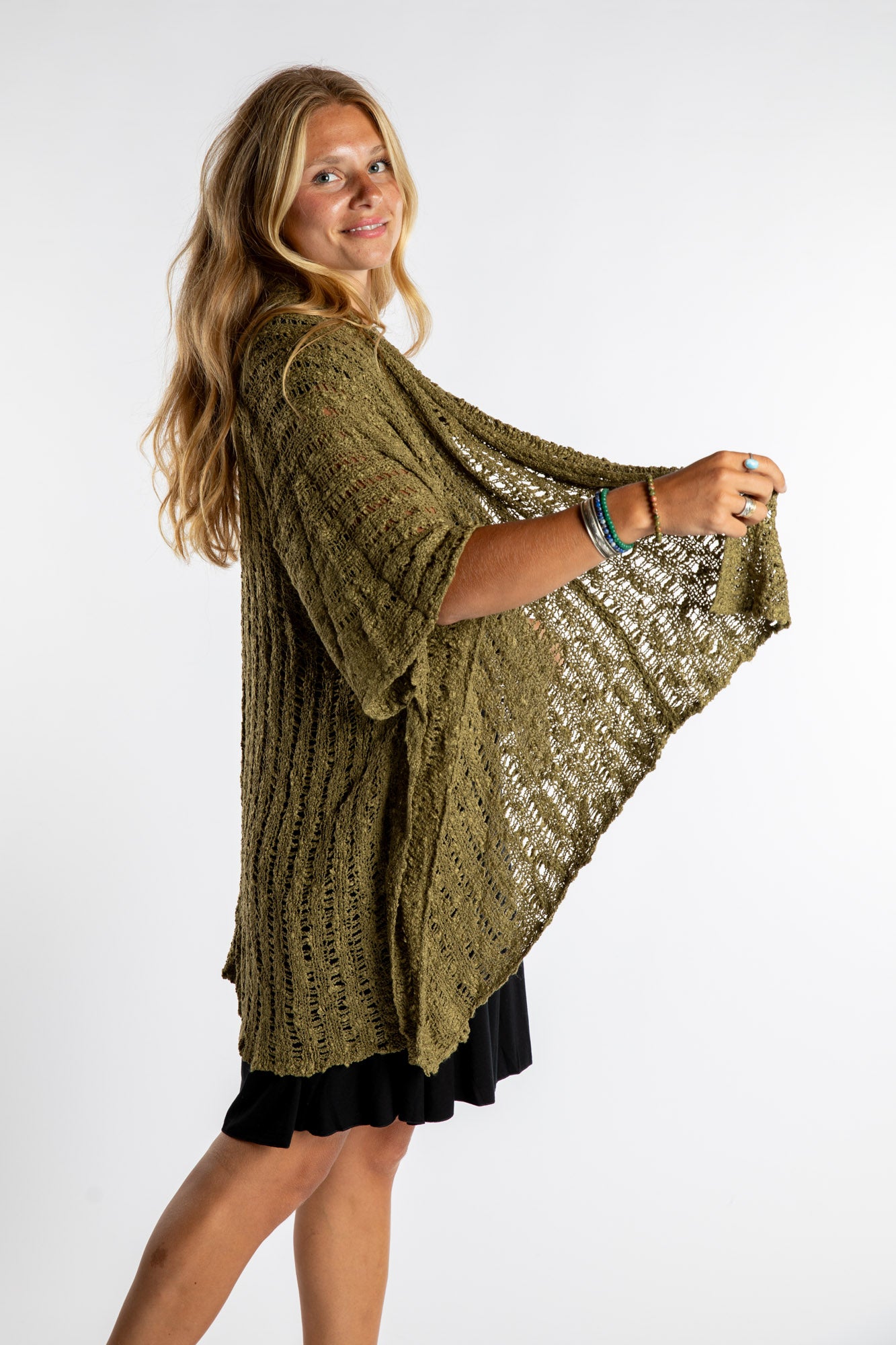 Sophie is wear the Cascade Loose Weave Cardigan in Olive