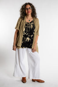 Susan is wear the Cascade Loose Weave Cardigan in Tan