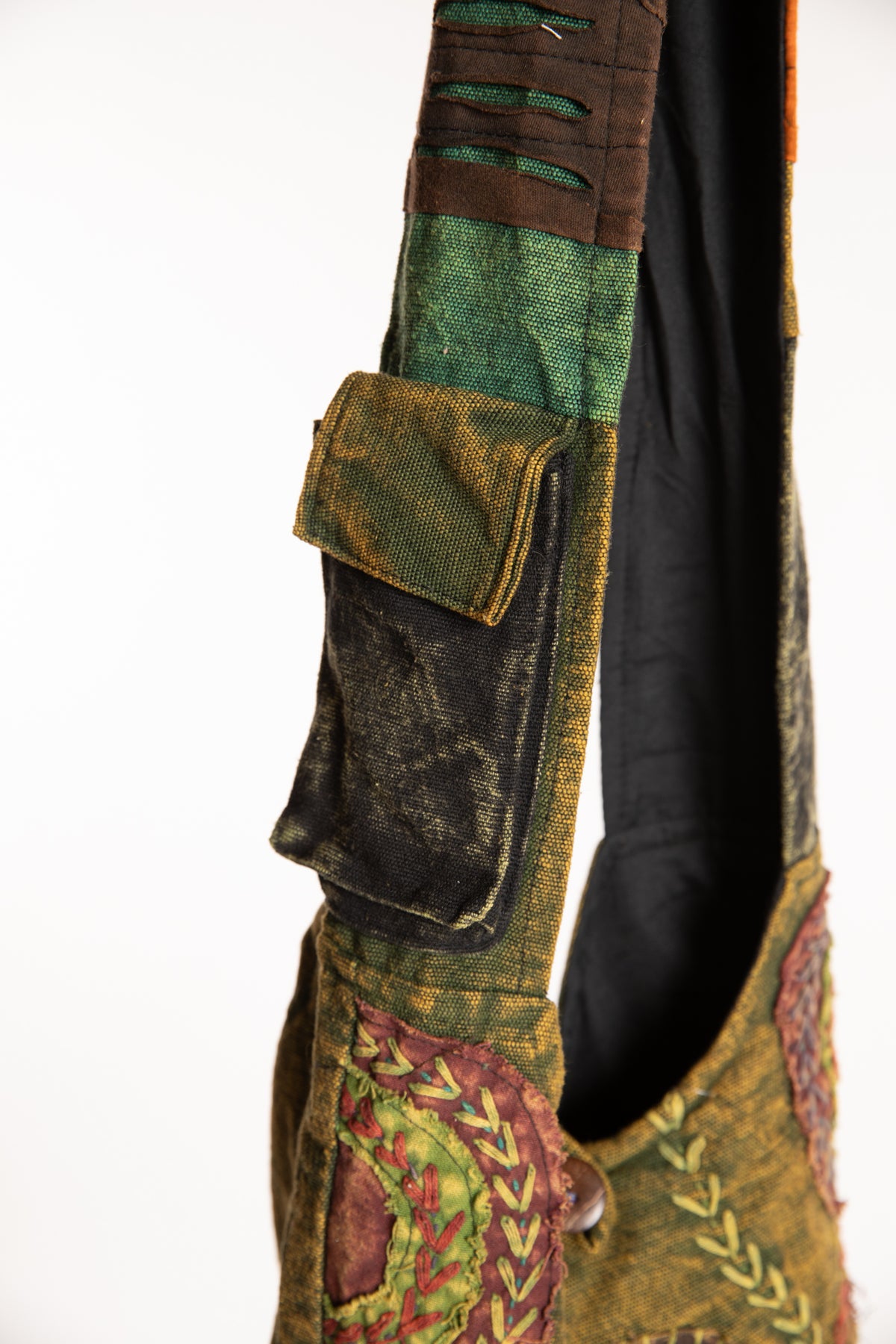 The Cosmic Spiral Sling Bag in Green