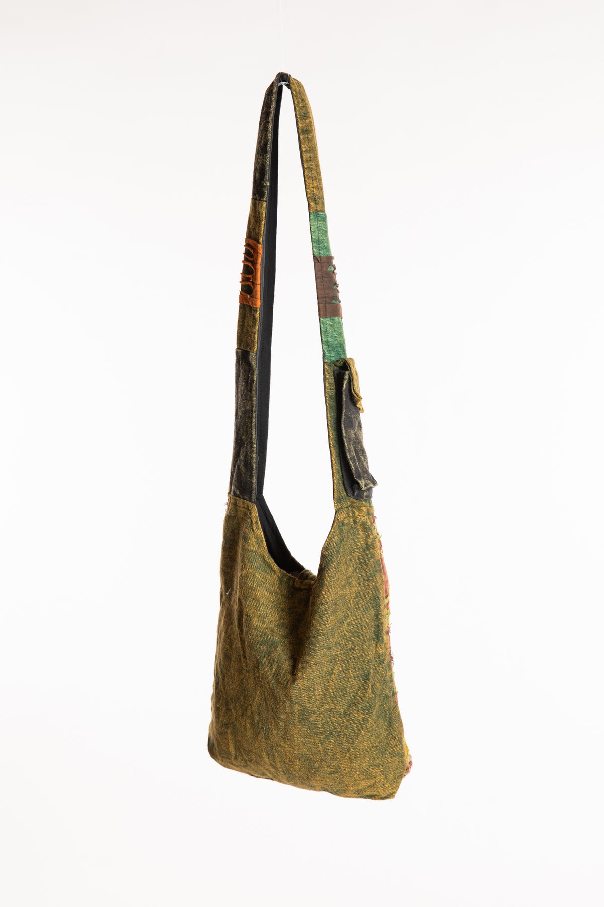 The Cosmic Spiral Sling Bag in Green