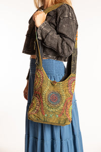 The Cosmic Spiral Sling Bag in Green