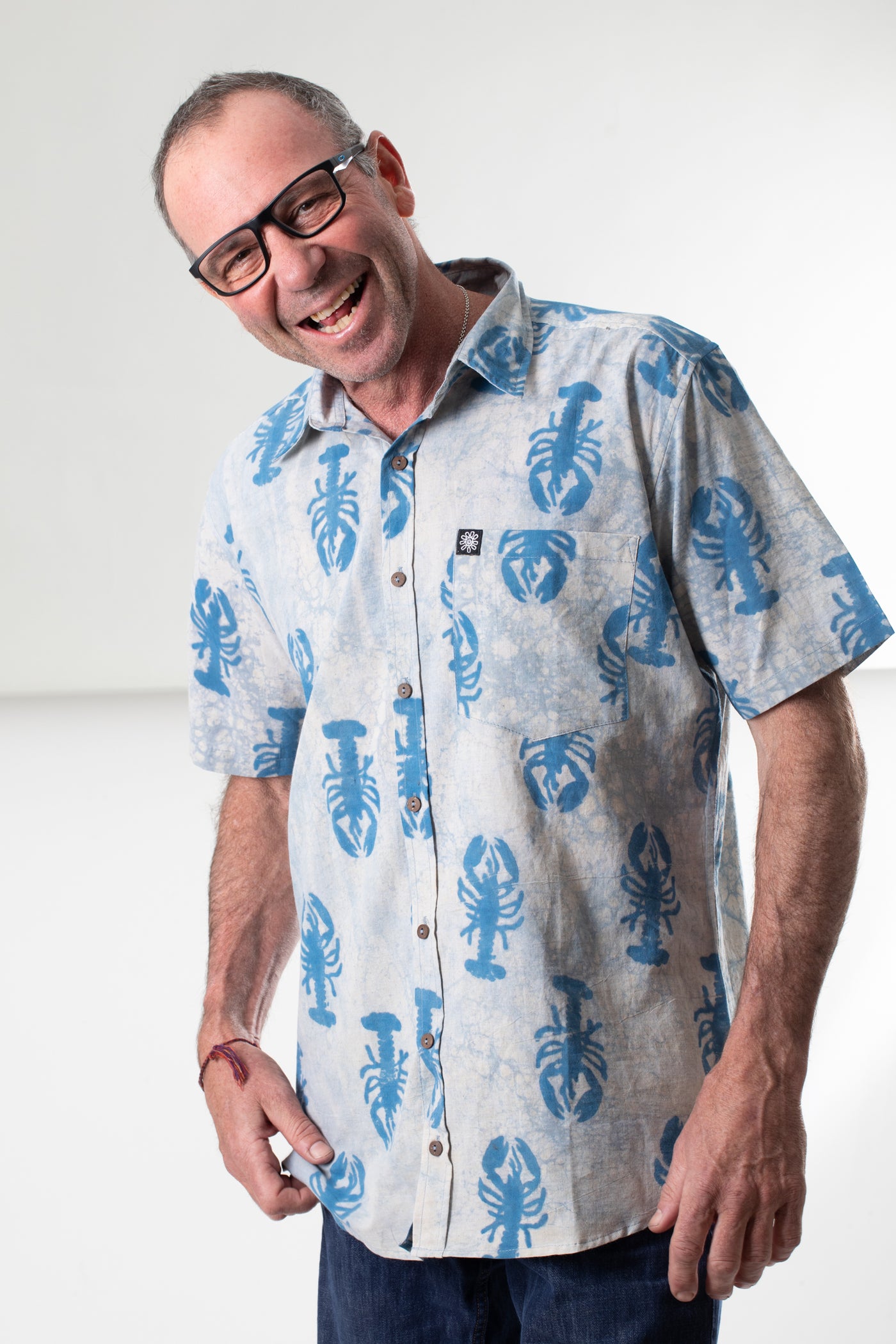 Ross is wearing size M lobster print button up in blue