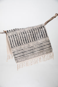 Block print woven rug in natural and black