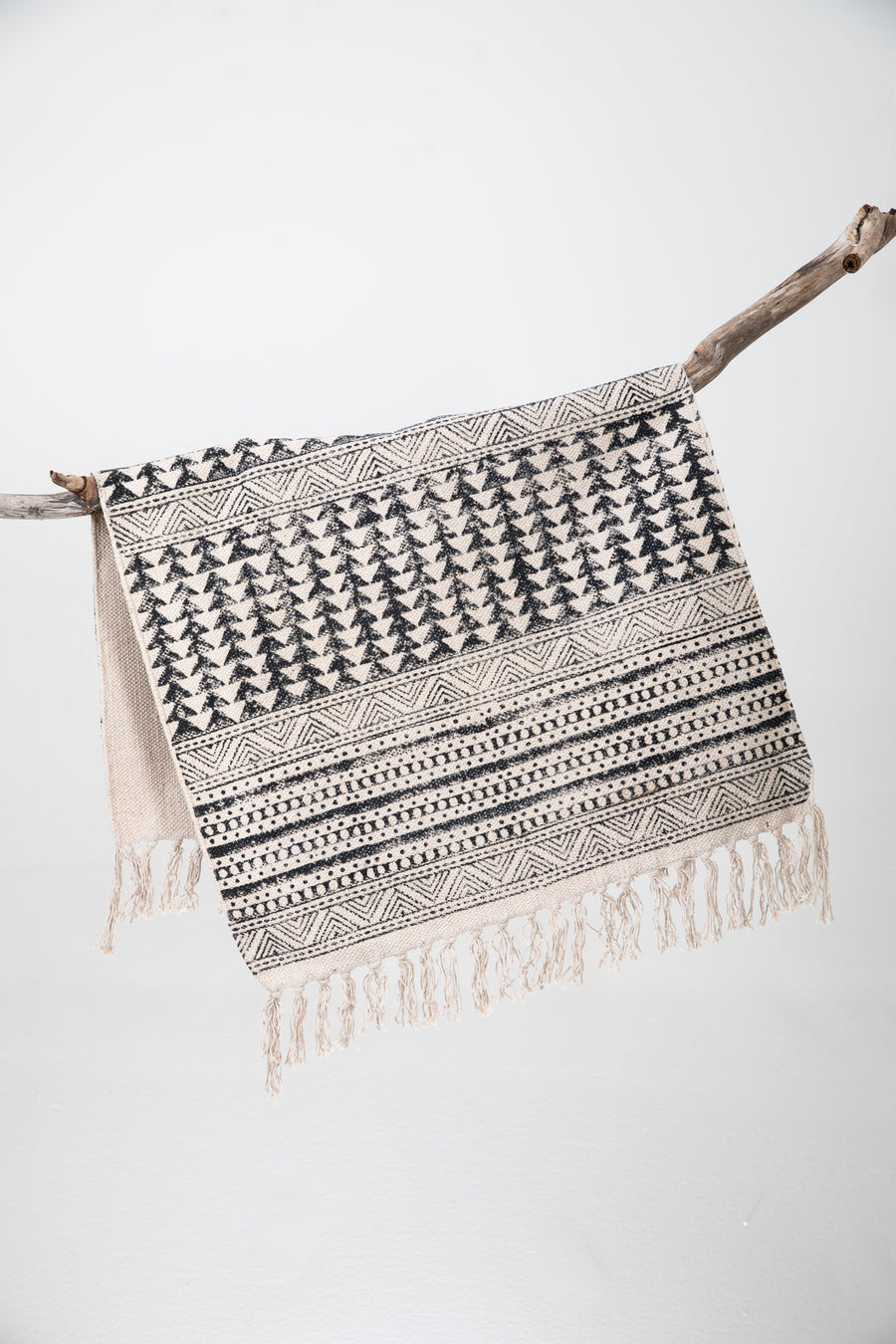 Block print woven rug in natural and black