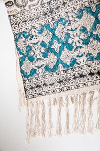 Block print woven rug in natural and teal