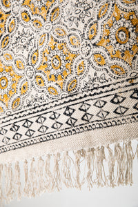 Block print woven rug in natural and yellow