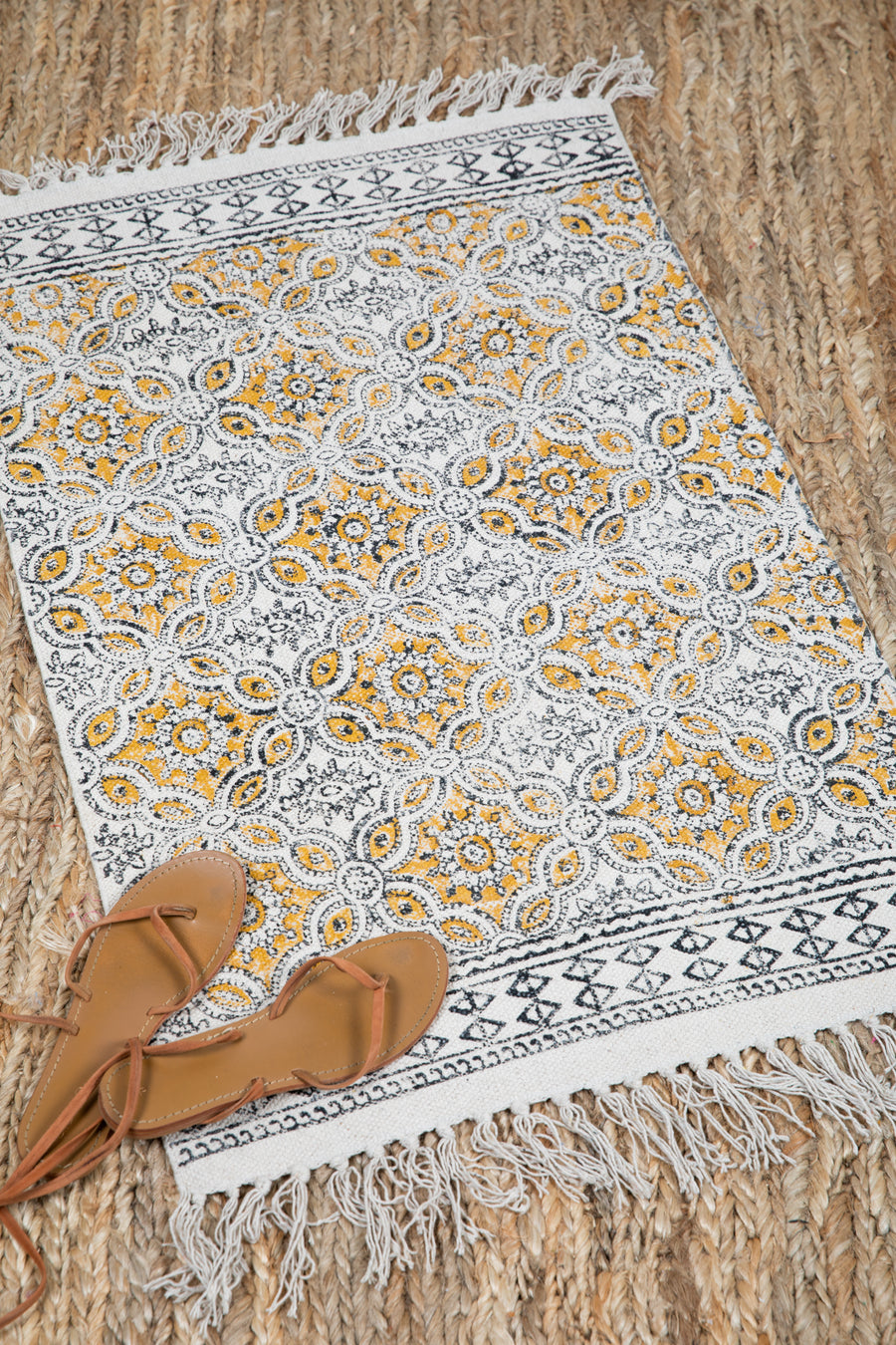 Block print woven rug in natural and yellow
