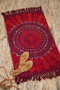 Block print woven rug in red mandala