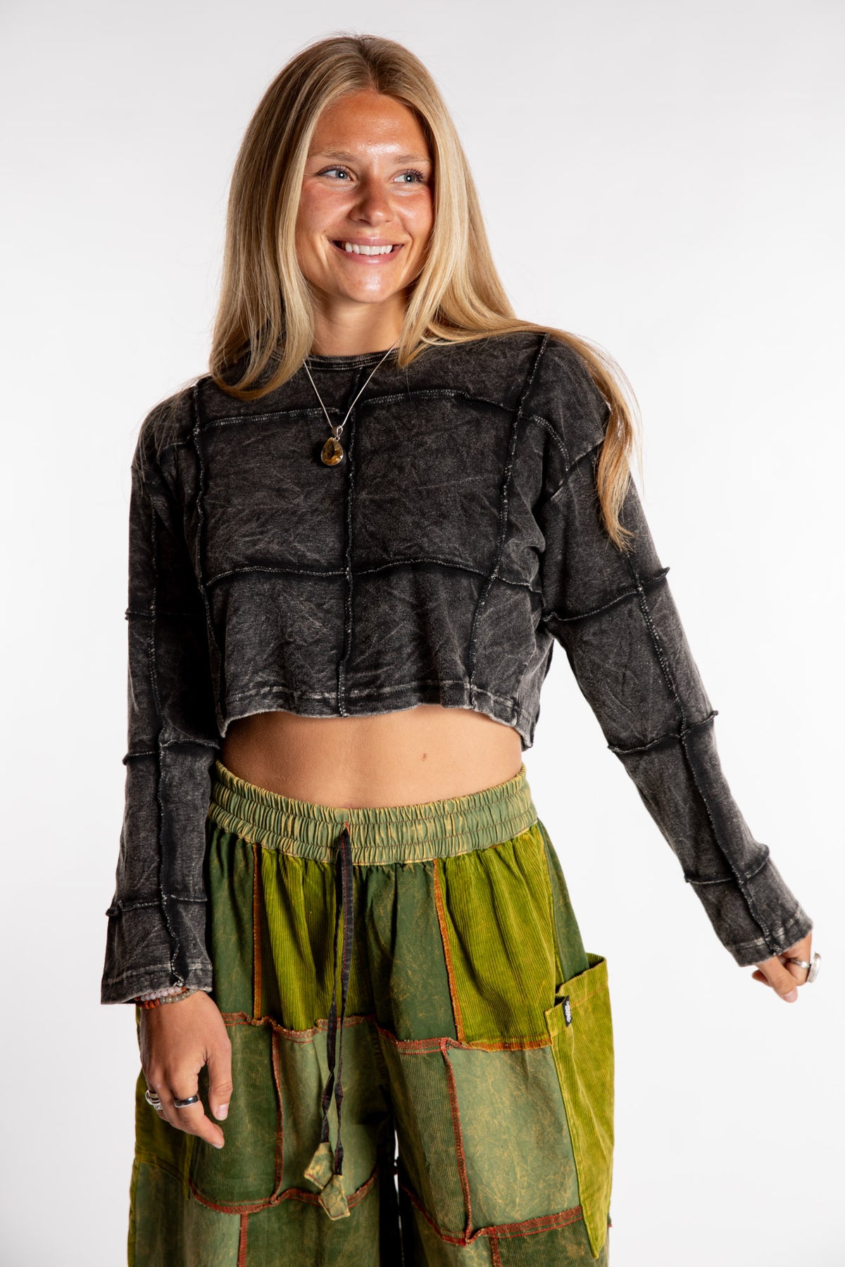 Sophie is wearing the S/M Didi Patchwork Crop Top in Black