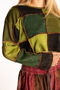 Sophie is wearing the S/M Didi Patchwork Crop Top in Green
