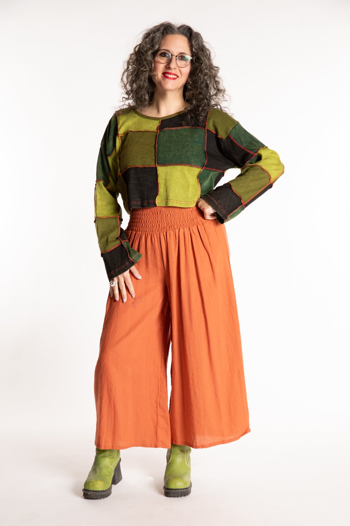 Susan is wearing the M/L Didi Patchwork Crop Top in Green