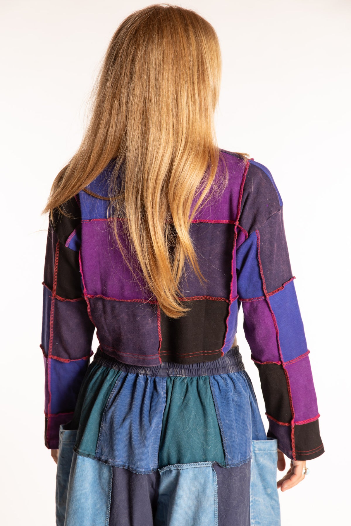 Sophie is wearing the S/M Didi Patchwork Crop Top in Purple