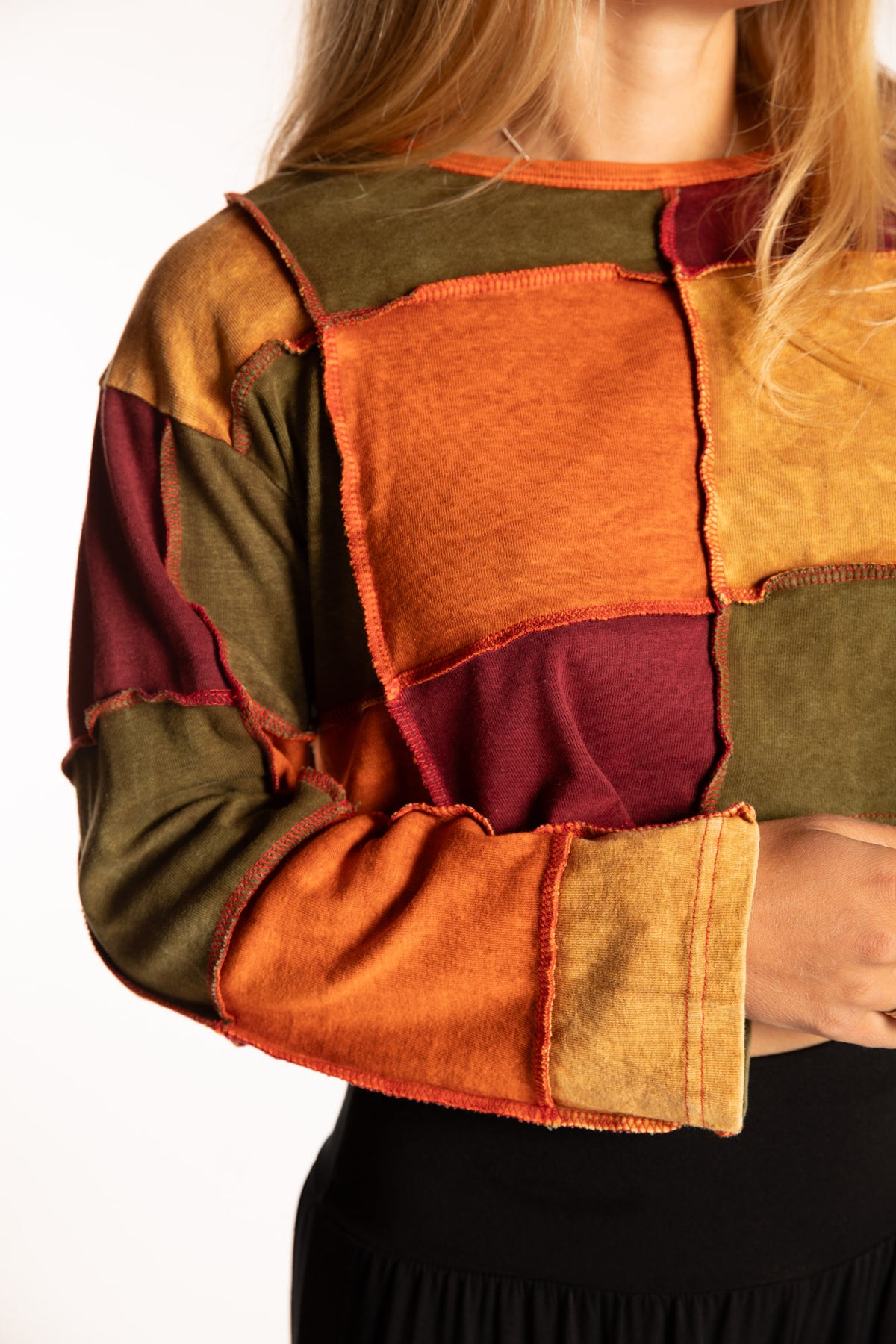 Sophie is wearing the S/M Didi Patchwork Crop Top in Rust