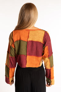 Sophie is wearing the S/M Didi Patchwork Crop Top in Rust