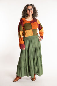 Susan is wearing the M/L Didi Patchwork Crop Top in Rust