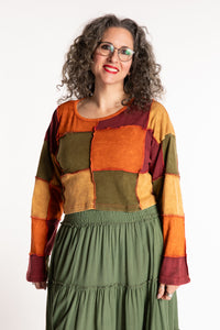 Susan is wearing the M/L Didi Patchwork Crop Top in Rust