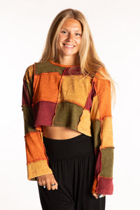 Sophie is wearing the S/M Didi Patchwork Crop Top in Rust
