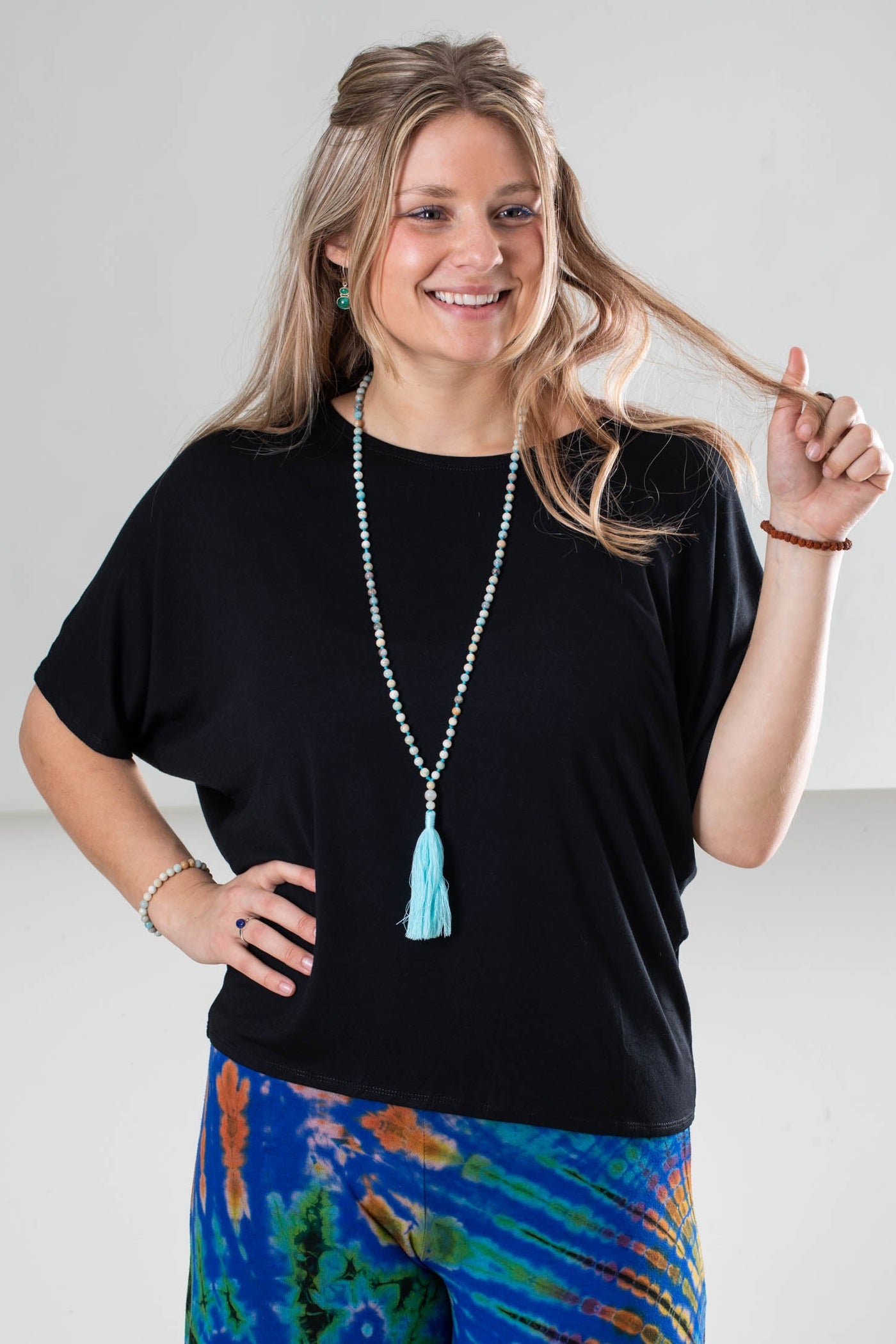Sophie wearing the Allie Dolman Sleeve Top size S/M in black