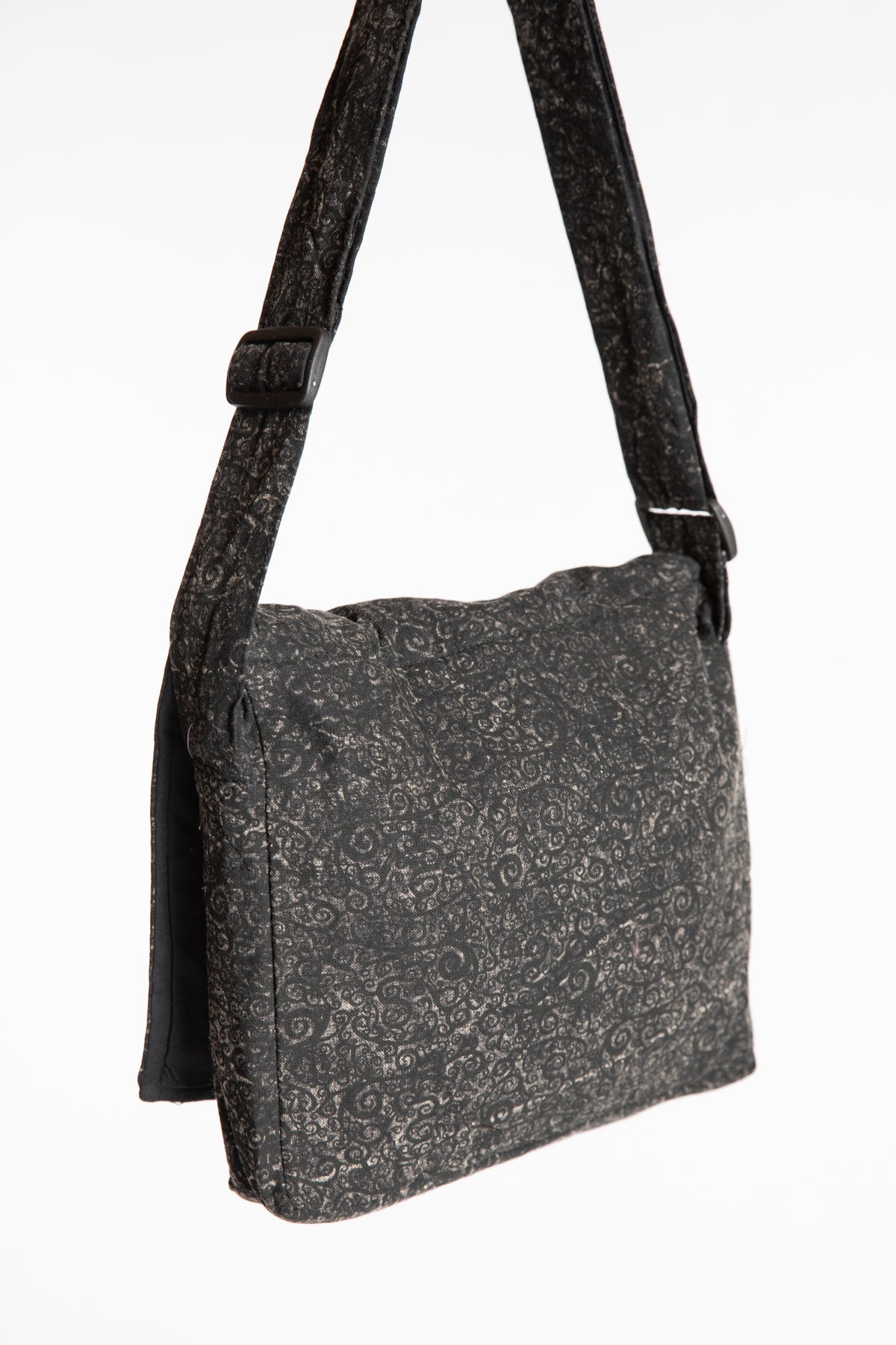 The black ebb and flow messenger bag 