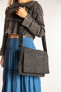 Sophie wearing black cotton messenger bag with adjustable strap