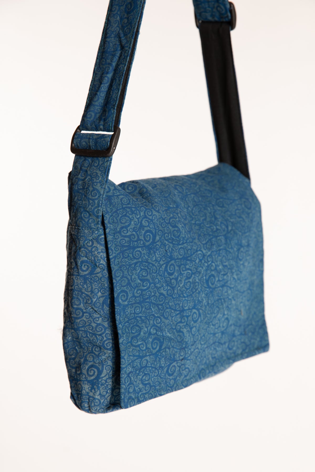 Blue ebb and flow messenger bag  with a black adjustable strap
