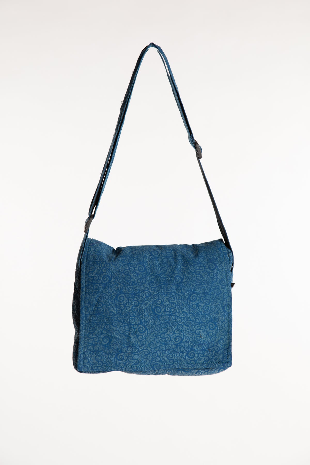Blue cotton messenger bag with adjustable shoulder strap and flap closure