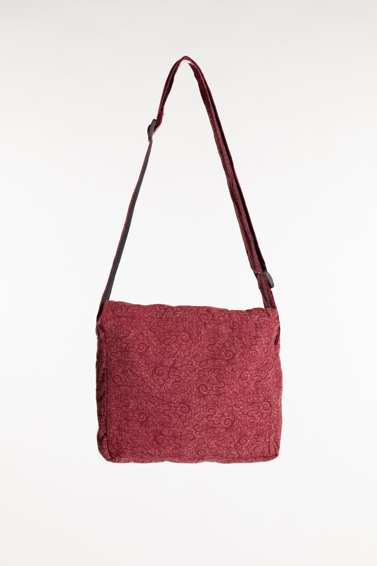 The red ebb and flow messenger bag with adjustable strap