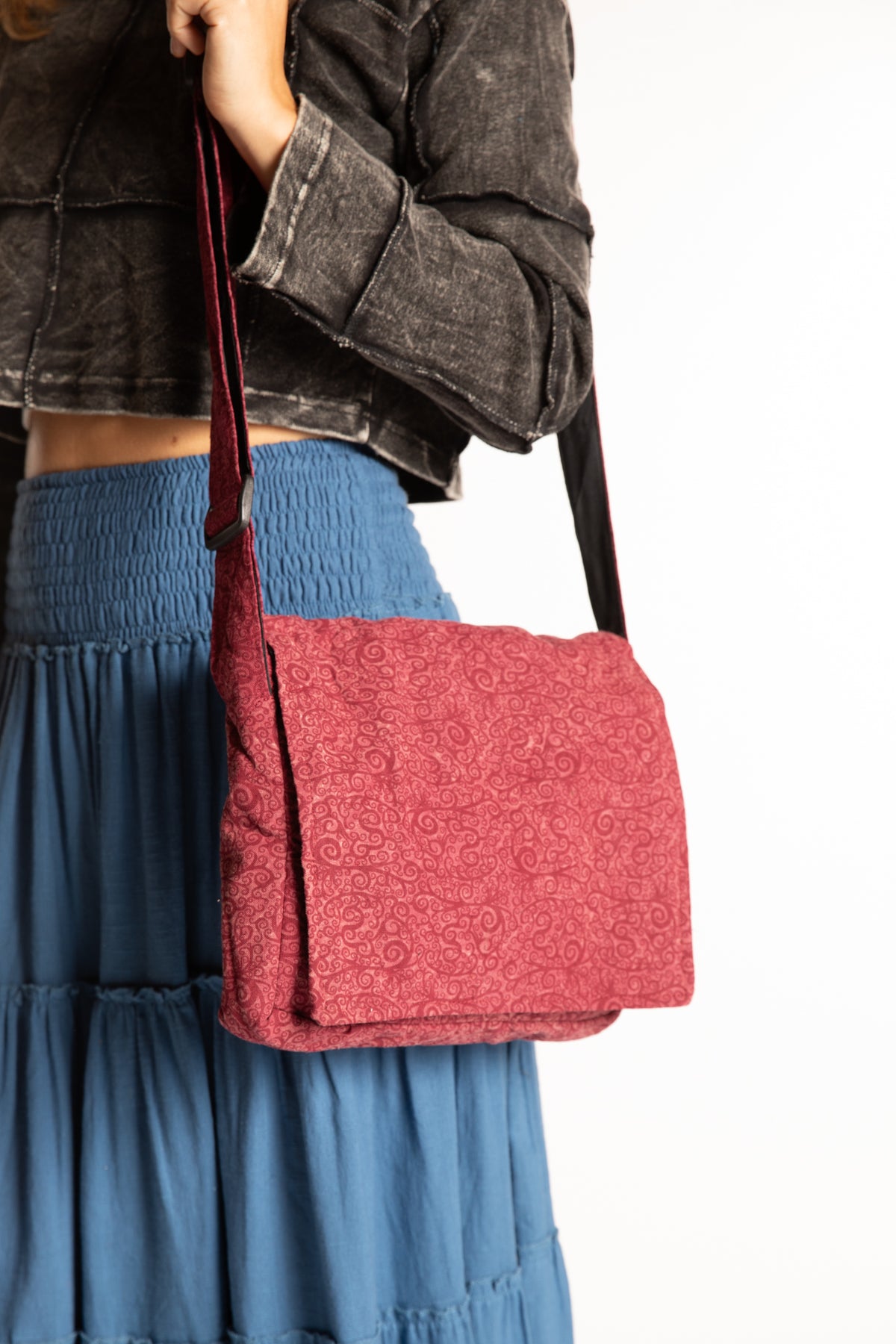 Sophie wearing red cotton messenger bag