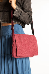 Sophie wearing red cotton messenger bag