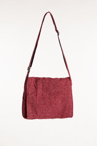 Red cotton messenger bag with foldover flap and adjustable shoulder strap