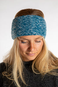 Sophie is wearing the Ember Plush Wool Headband in Aqua