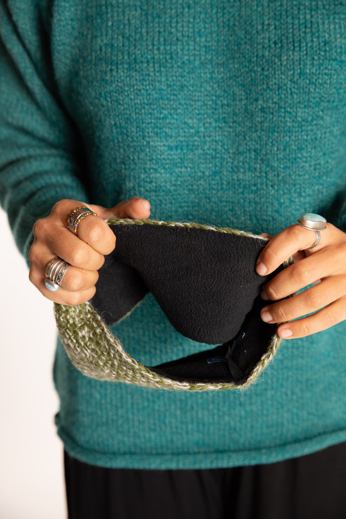 Sophie is wearing the Ember Plush Wool Headband in Green