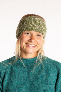 Sophie is wearing the Ember Plush Wool Headband in Green