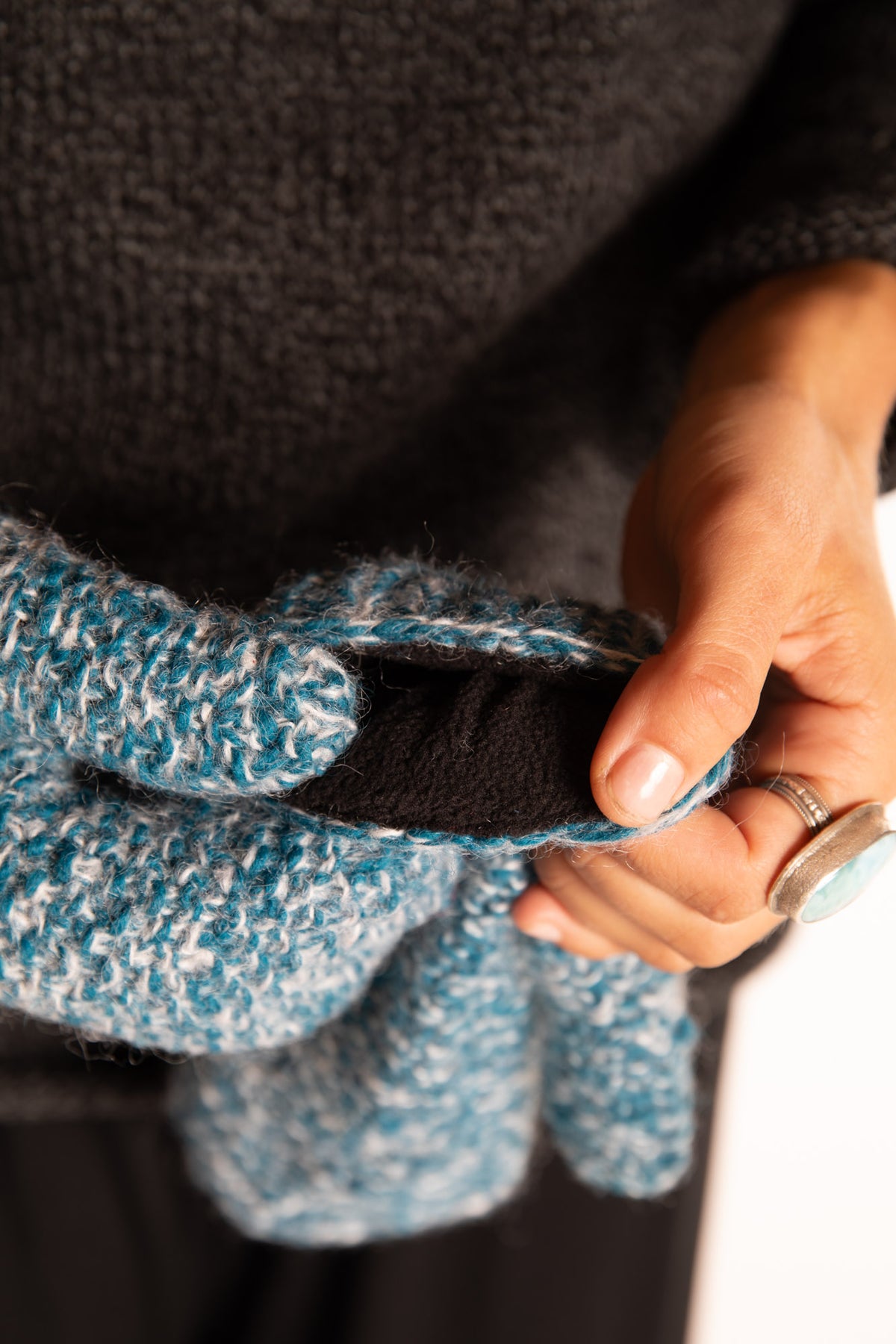 Sophie is wearing the Ember Plush Knit Wool Mittens in Aqua