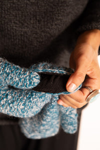 Sophie is wearing the Ember Plush Knit Wool Mittens in Aqua