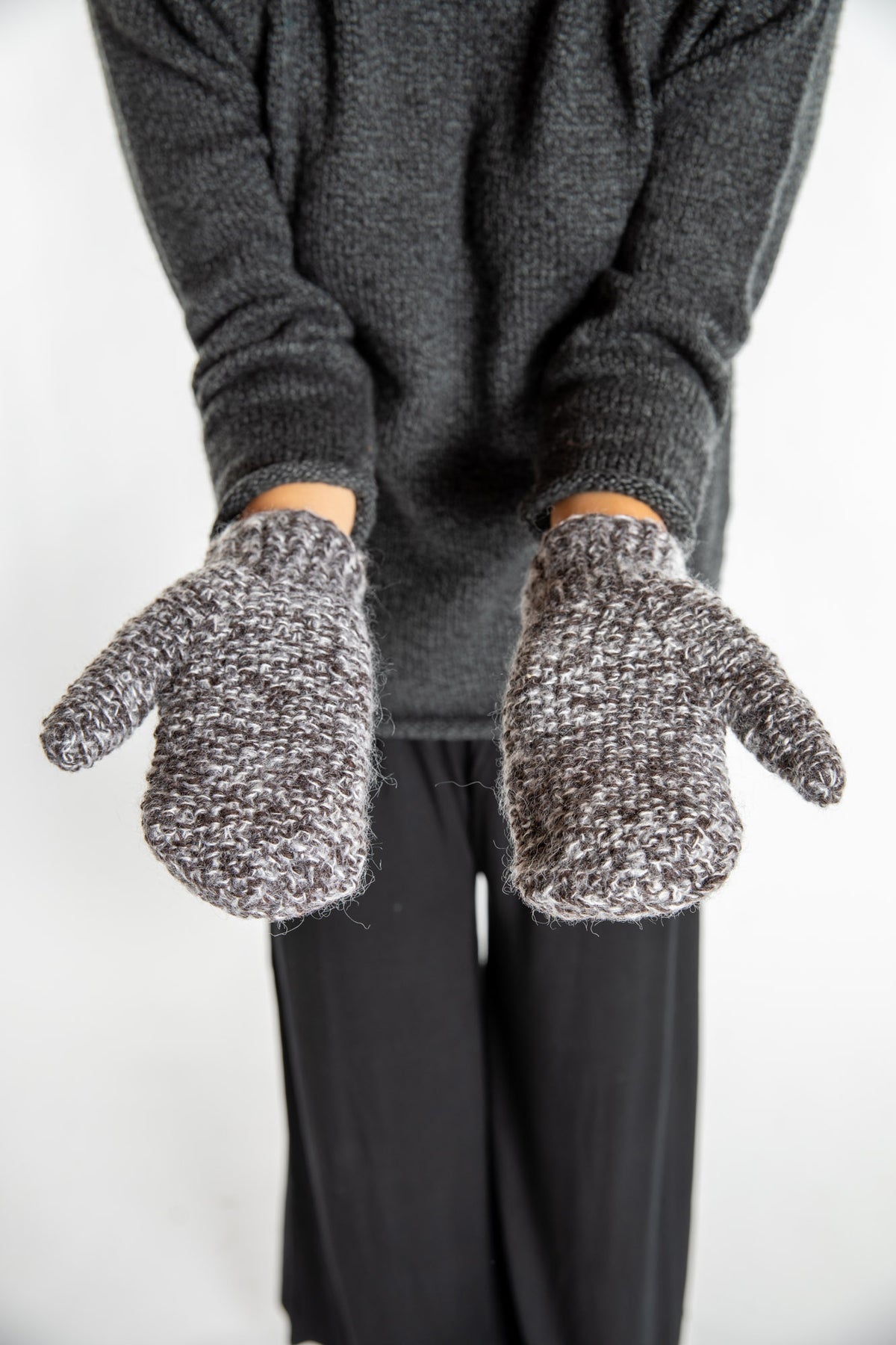 Sophie is wearing the Ember Plush Knit Wool Mittens in Brown