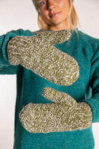 Sophie is wearing the Ember Plush Knit Wool Mittens in Green