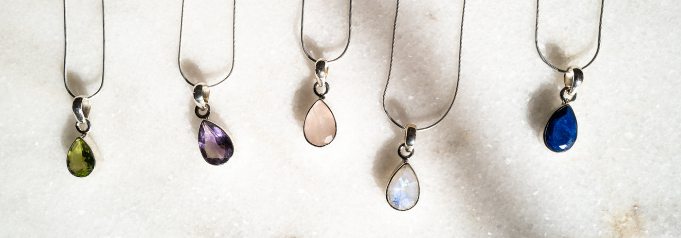 faceted_teardrop_gem_necklace_lifestyle2.jpg__PID:65cb9a01-402d-4341-89ca-e3e2aed9826b