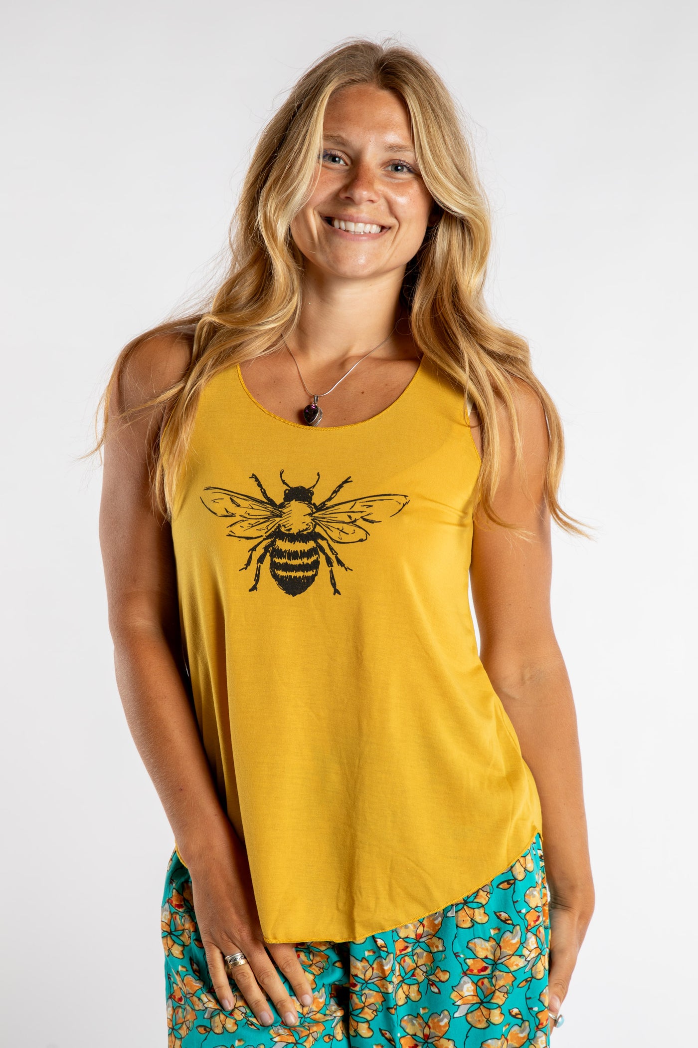 Sophie is wearing size S/M tank top in Bee Kind