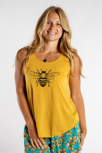 Sophie is wearing size S/M tank top in Bee Kind