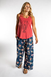 Sophie is wearing size S/M tank top in Red Lobster with printed penny lane pants